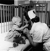 A nurse providing care to a pediatric patient.