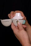 Step 3: Open the mouthpiece of the HandiHaler® by lifting the mouthpiece ridge.