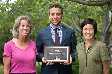 Shown with the CACME award are Pearlanne Zelarney, MS from Research Informatics Services, Matthew Stern from The Office of Professional Education, and Dr. Darlene Kim, program co-chair.