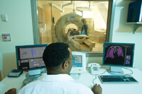 Man monitoring a CT scan