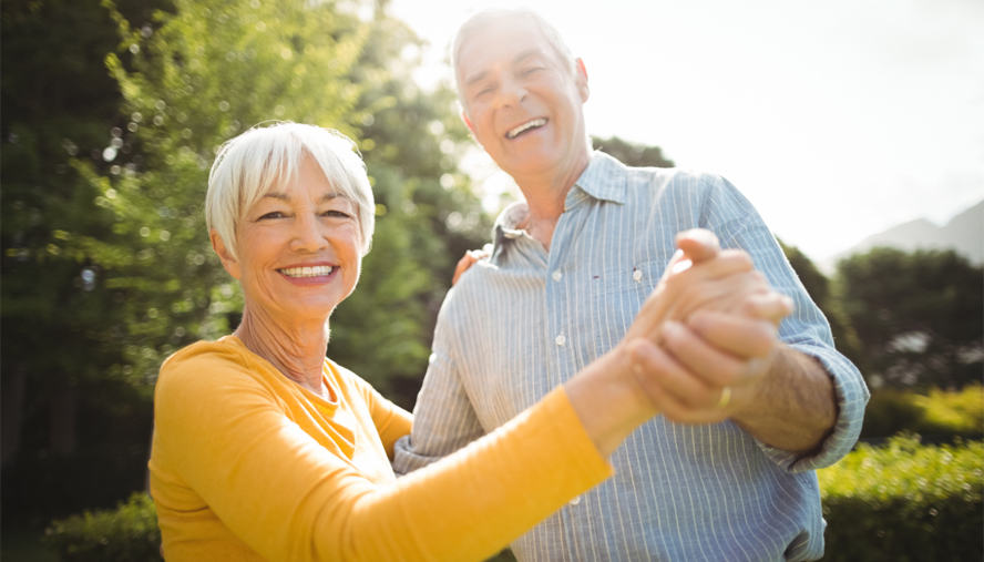 Elderly man and woman dancing.