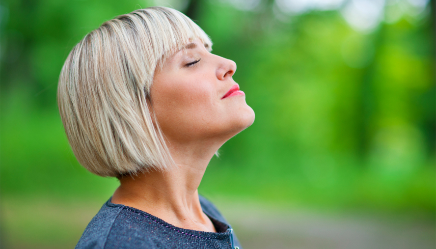 Woman smelling the world around her