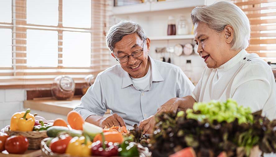 Couple prepping food together