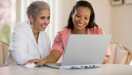 senior being helped by her daughter