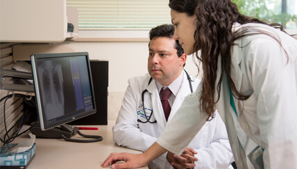 doctors looking at computer